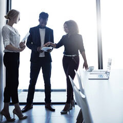 Canvas Print - Business people, tablet and discussion in office for collaboration, brainstorming and project feedback. Team, employees and communication in workplace for diversity, proposal and company development