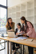 © SOMKID - Asian businesswoman teamwork working on laptop with finances analysis report at desk in office, business financing, accounting banking, Team of creative and business planning,