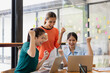© SOMKID - Excited Asian businesswoman team working together in office, About successful startup projects concept.