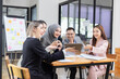 © SOMKID - Team of Asian business people and working together in office, Startup projects and business presentation at meeting room.