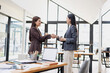 © SOMKID - Business people shaking hands in office, Asian businesswoman making handshake with partner in meeting room, Greeting and corporate business handshake, 
