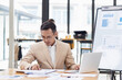 © SOMKID - Happy asian businessman working with business financing accounting banking and laptop with finances analysis report at desk in office.