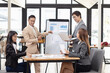 © SOMKID - Asian business teamwork working with analysis report and advisor showing plan, Financial analysis and Marketing teamwork concept.
