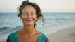 © Kevin - Happy 40-Year-Old Woman Smiling Serenely on the Beach
