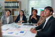 © crizzystudio - Asia business group meeting and discuss new startup concept projects Business team planning, strategic analysis and brainstorming with office paper reports.