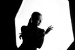 © ugis - Silhouette of Woman Posing Elegantly in Studio Lighting