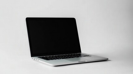 Poster - A stylish laptop rests on a pristine white background, showcasing its modern design and bright screen