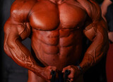 bodybuilder body part details. bodybuilder in competition, detail.