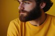 © Goncharenko - Man with beard wearing yellow shirt