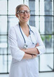 © Katsiaryna - Portrait of a young doctor with glasses in a hospital