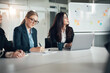 © Flamingo Images - Businesswomen working during a boardroom meeting in an office