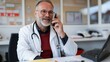 © Archil - A cheerful doctor with a stethoscope chats on the phone in a modern office, exuding warmth and professionalism.