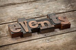 © eyewave - events, word written with vintage letterpress printing blocks, angled view, rustic wooden background