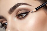 Close-up of a woman's eye with eyebrow pencil application, natural makeup detail, beauty and cosmetics concept, precision and definition, professional makeup, studio photography, subtle and elegant.