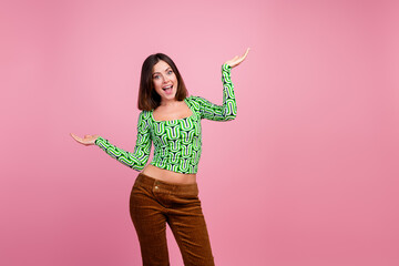 Wall Mural - Photo of lovely adorable woman wear green clothes empty space isolated on pink color background