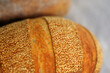 © Tymofii Ignatiev - Closeup photo of crust with sesame seeds of home baked bread