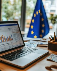 Poster - A financial analyst's desk displaying performance charts on a laptop near a European Union flag during a workday
