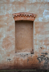 Wall Mural - Weathered brick and stone wall with walled up window showcasing rustic texture