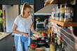 © Geber86 - Young woman cooking healthy vegetables in modern kitchen