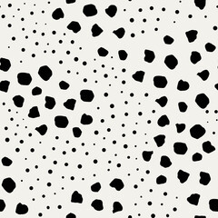 Vector dotted background. Irregular, imperfect dot pattern. Groups of big and small dots. Seamless hand drawn ornament made on tablet. Black and white illustration