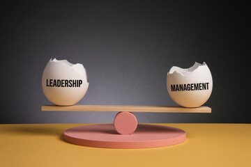 Fototapete - Cracked eggs on a seesaw represent leadership and management.
