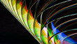 © Connect Images - Close-up of colorful refracted light patterns on a curved surface against a dark background.