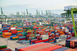 © Connect Images - Aerial view of a busy cargo terminal with numerous colorful shipping containers stacked and ready for transport, Singapore