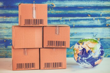 Poster - Global shipping represented by stacked boxes  barcodes  globe  background.