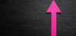 © DJSPIDA FOTO - A vibrant pink arrow points upward against a textured black background, symbolizing direction and progress in a striking visual contrast.