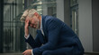 © Yuliia - Caucasian old senior businessman feel bad unwell upset mature business man stressed middle-aged stress despair employer in city outdoors feeling headache migraine suffering problem take off glasses