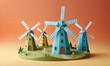 © Miklos - Three colorful paper windmills stand tall in a grassy field against an orange backdrop