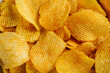 © Nataliia Sirobaba - Wavy potato chips close-up.