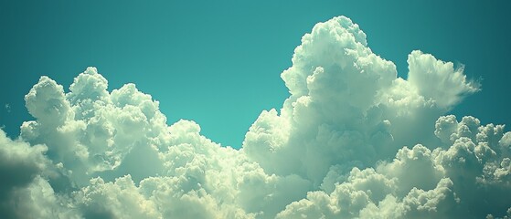 Wall Mural - A serene sky filled with fluffy white clouds against a bright blue backdrop.