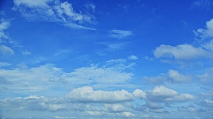 Wall Mural - time lapse of blue sky with white clouds