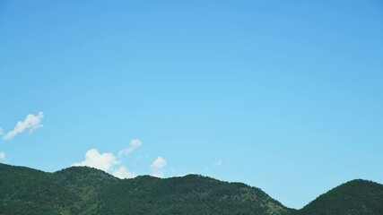 Wall Mural - Time lapse of landscape of blue sky and mountains