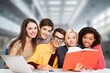 © BillionPhotos.com - Diverse group of students studying at library.