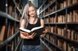© BillionPhotos.com - Young woman student reading library book