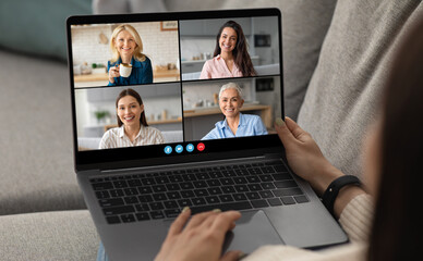 Poster - A person sits on a couch, engaging in a video call with four friends. Everyone appears joyful, sharing stories and laughter in a cozy living room setting.