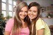 © BillionPhotos.com - Happy young female Friends hugging at home