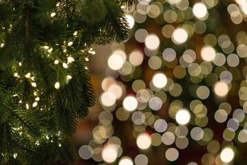 Wall Mural - merry christmas and new year holidays background. blurred bokeh background with light bulbs and chri