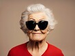© Rayan Heaven - Smiling Elderly Woman in Sunglasses Portrait. A joyful elderly woman wearing stylish sunglasses, showcasing a bright smile against a dark background.