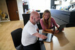 © ADDICTIVE STOCK - Disability man using laptop, sharing moments with a friend