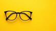 © amarta - Black Eyeglasses on Yellow Background