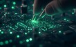 © AhmadTriwahyuutomo - A hand manipulates a glowing circuit board, showcasing intricate electronic components and a futuristic design.