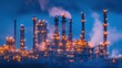 © Chatchanan - Close-up of refinery towers and pipelines glowing under bright