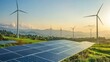 © Chatchanan - Solar panels and towering wind turbines spread across a green field,