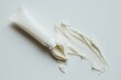 © thewarit - A white cream tube is placed on a white background.