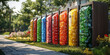 © DOUGLAS - Colorful recycling bins for plastic bottles in park, sorted by color, promote environmental awareness and sustainability. Sunlight enhances vibrant hues of containers