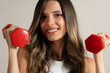 © Lomb - Young woman smiling dumbbells fitness workout healthy lifestyle exercise motivation wellness training sport
