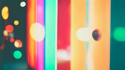 Poster - Vibrant neon lights in various colors with bokeh circles create a lively and energetic urban backdrop, full of excitement and glow.